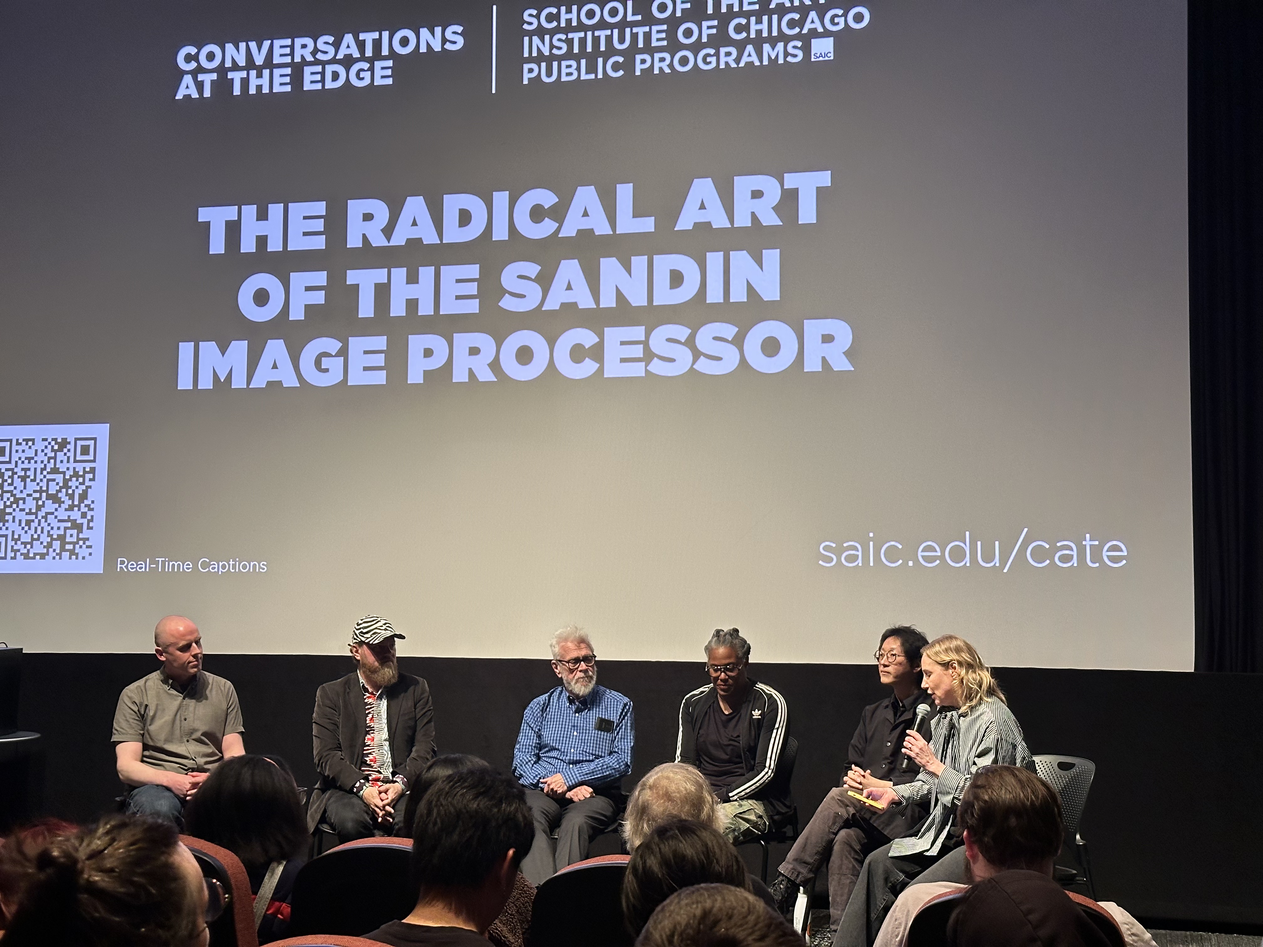 James Connolly, Jon Satrom, Dan Sandin, Lee Blalock, Gordon Fung, and Amy Beste on stage at the Gene Siskel Film Center having a panel discussion for 'The Radical Art of the Sandin Image Processor'.