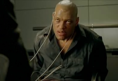 Still from the movie The Matrix showing Morpheus sitting on a chair.