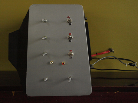 A modified RadioShack TRS 80 computer from the 1980s viewed from the side.